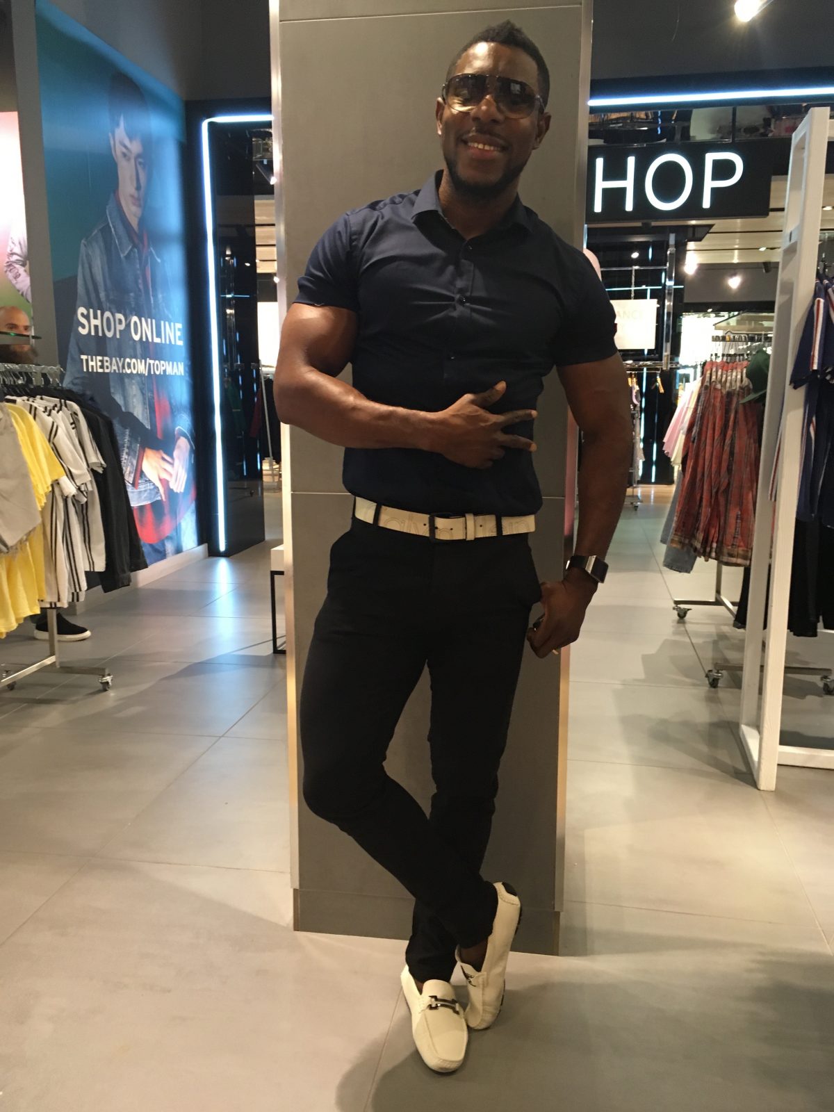 African origin man in Miss ssiauga wearing navy blue short denim jeans loafers