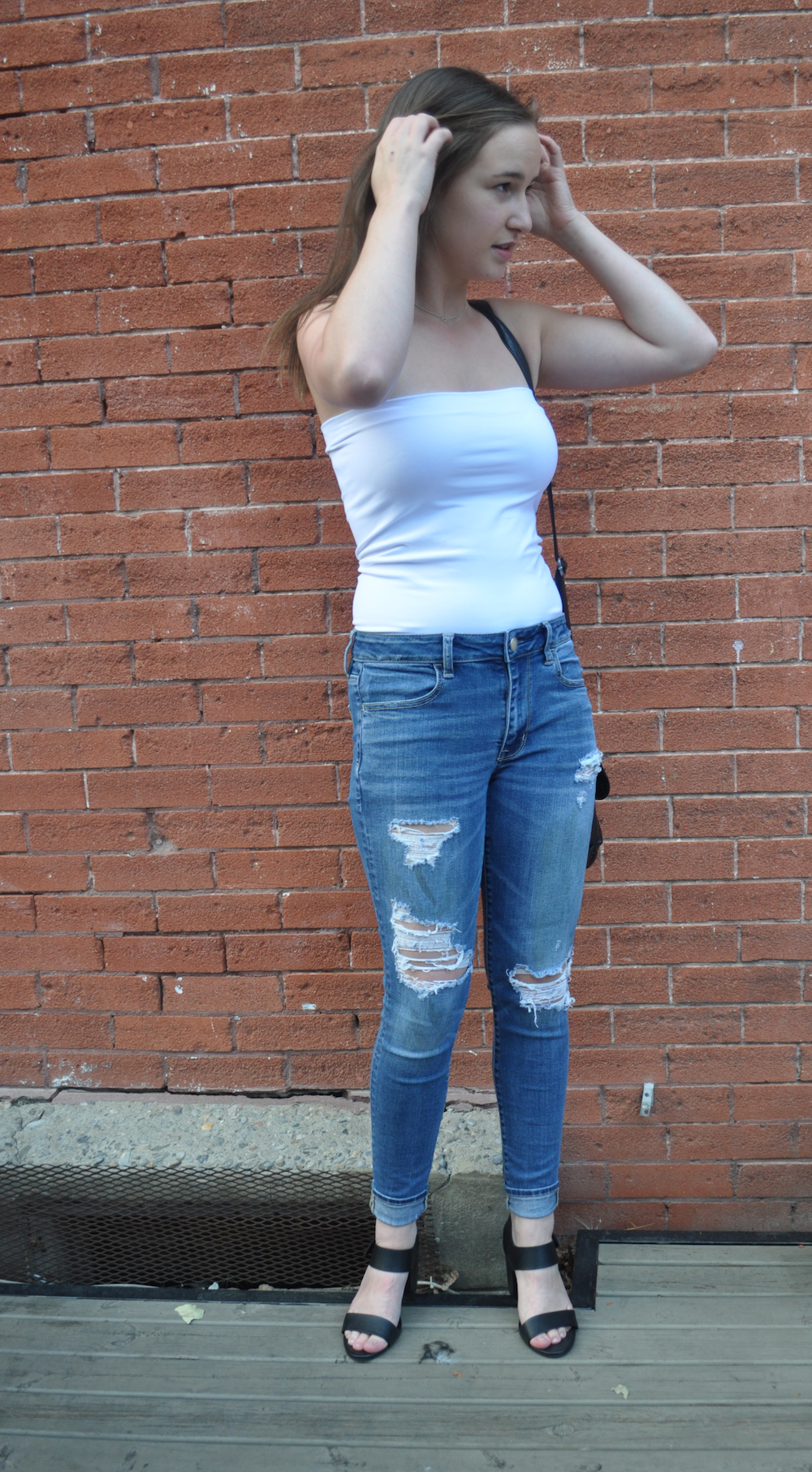white tube top and ripped denim blue jeans